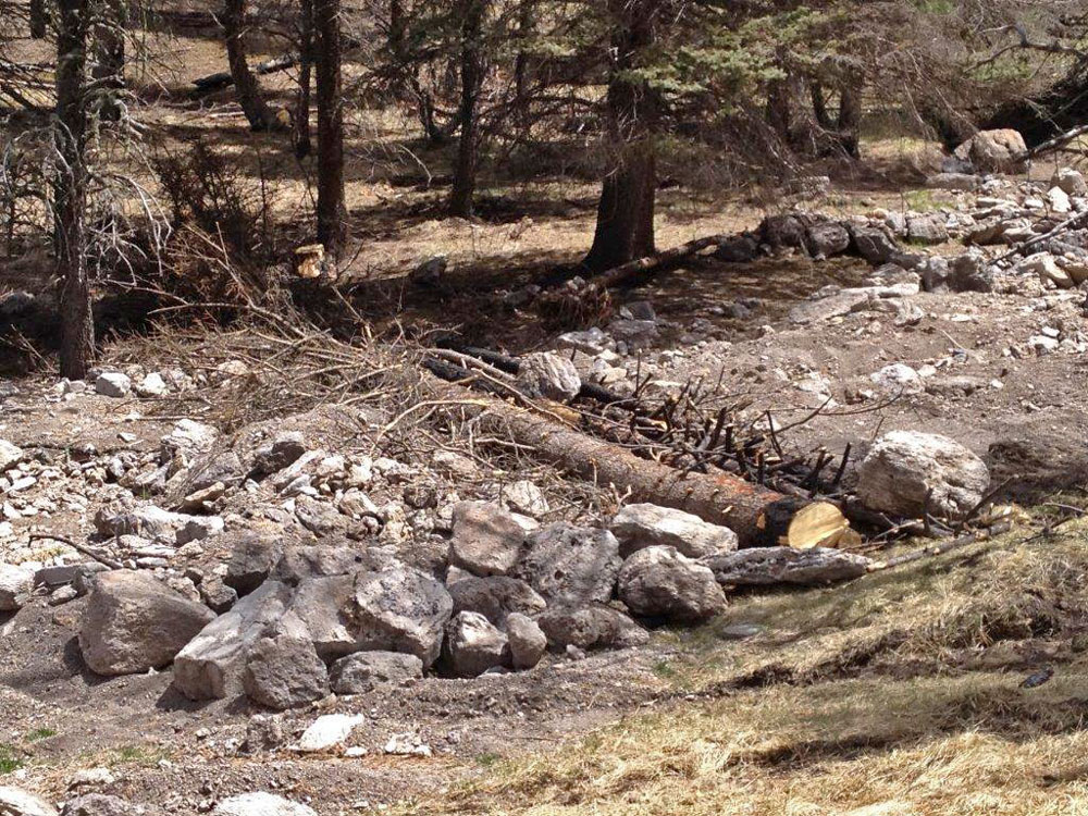 A gully plug and diversion to the original alluvial fan surface