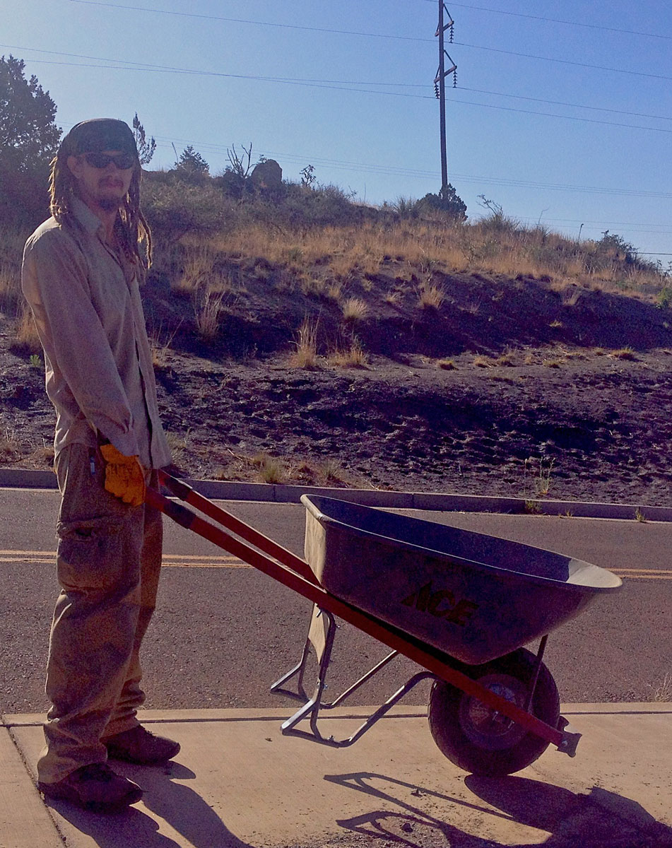 Stream Dynamics employee with wheelbarrow